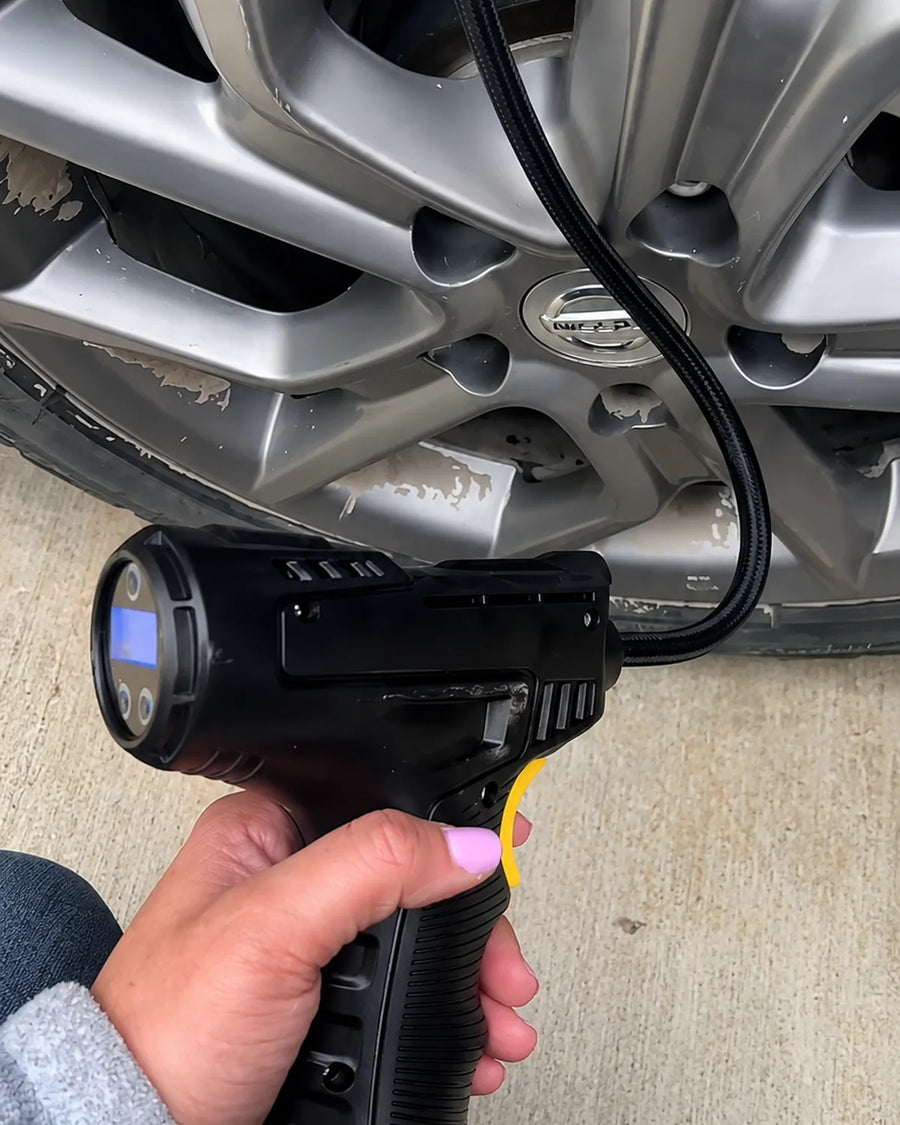 Product detail photo - Cordless inflator connected to a real wheel
