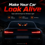 Solar LED Evil Eyes installed on a rear windshield at night