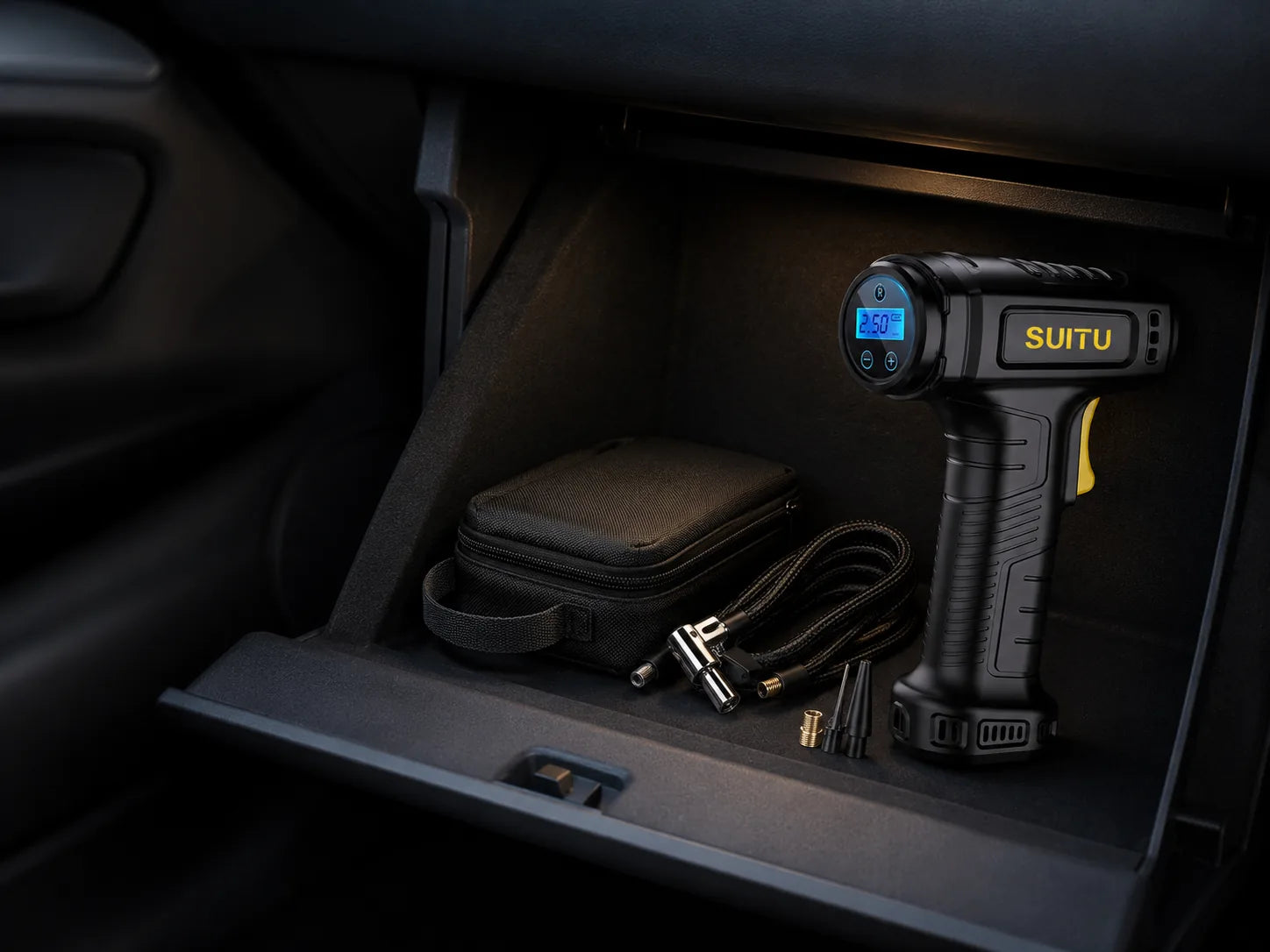Cordless tire inflator and accessories stored inside a car, desktop layout