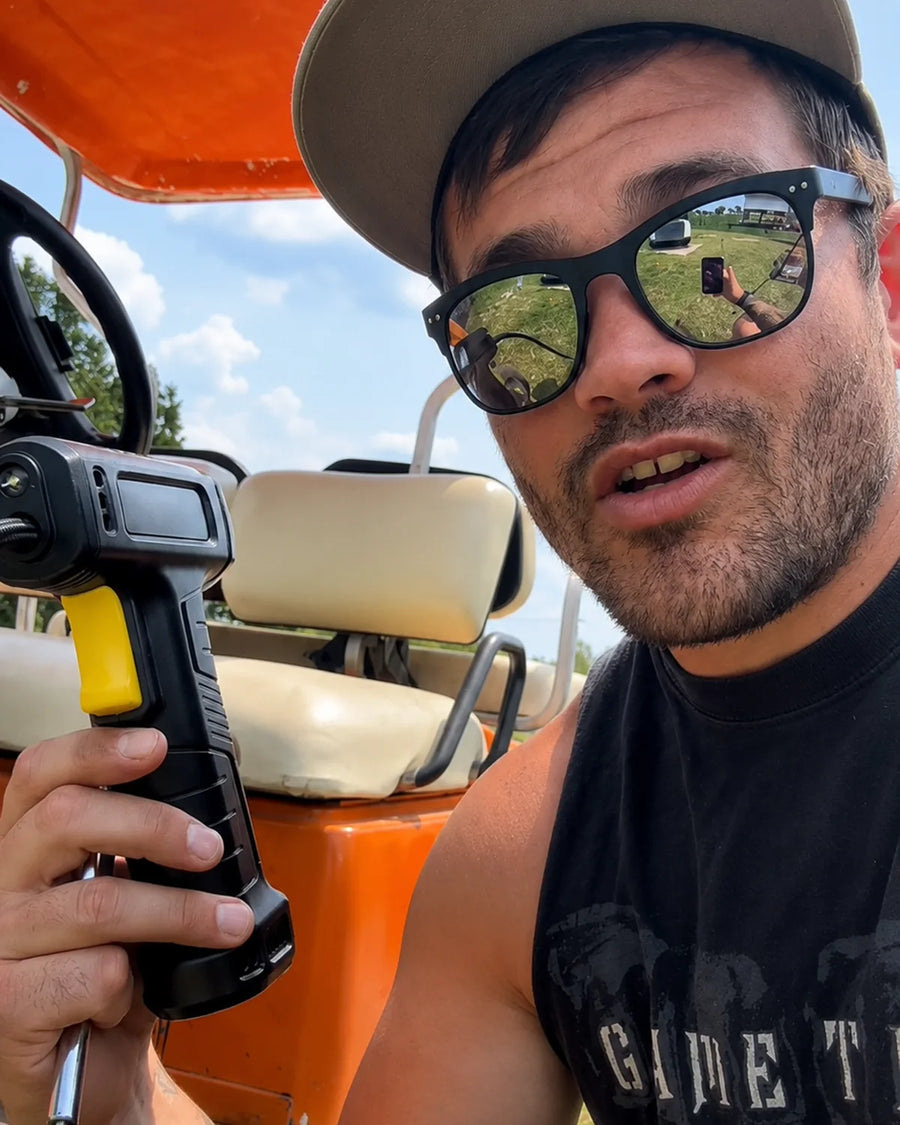 UGC photo - Creator holding cordless inflator outdoors